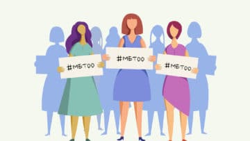 A group of women hold 'me too' placards