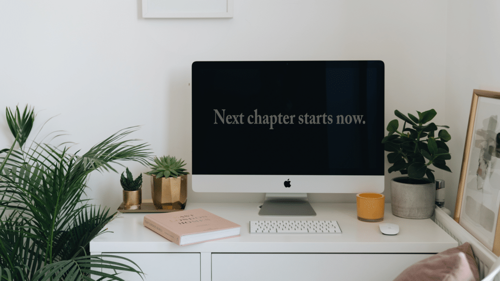 computer on desk that reads "next chapter starts now."