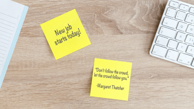 desk with keyboard and post-its reading "new job starts today!" and a Margaret Thatcher quote