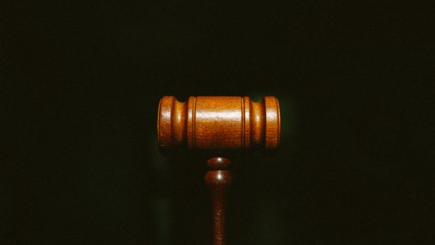 Wood gavel on dark background