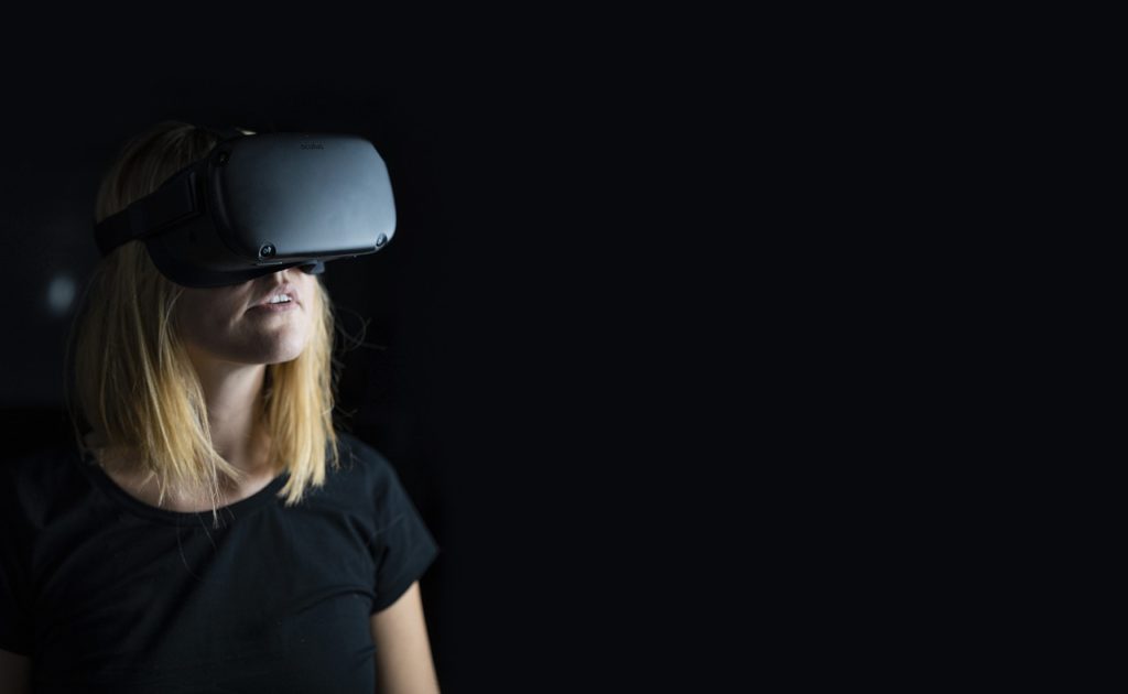 A woman uses a virtual reality headset