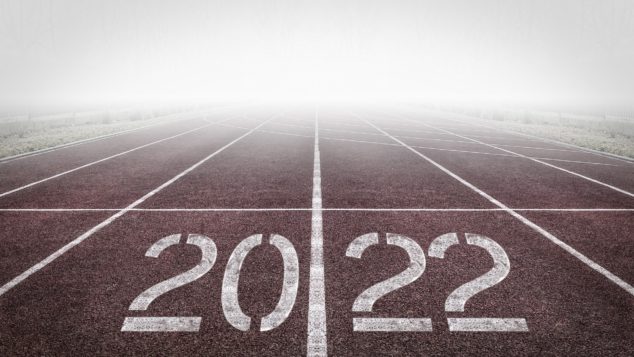 A track and field starting line shows the year 2022.