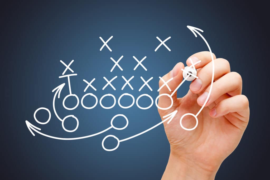 Event Strategy Concept: Coach Drawing American Football Game Playbook